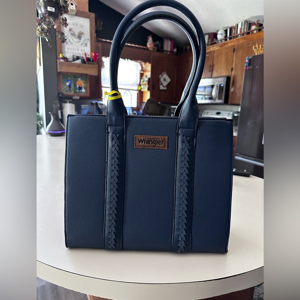 Navy wrangler bag. NWT.